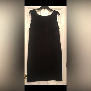 A “little black dress” with back zipper and centered back split. Size 16.